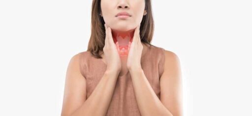 woman holding her thyroid gland